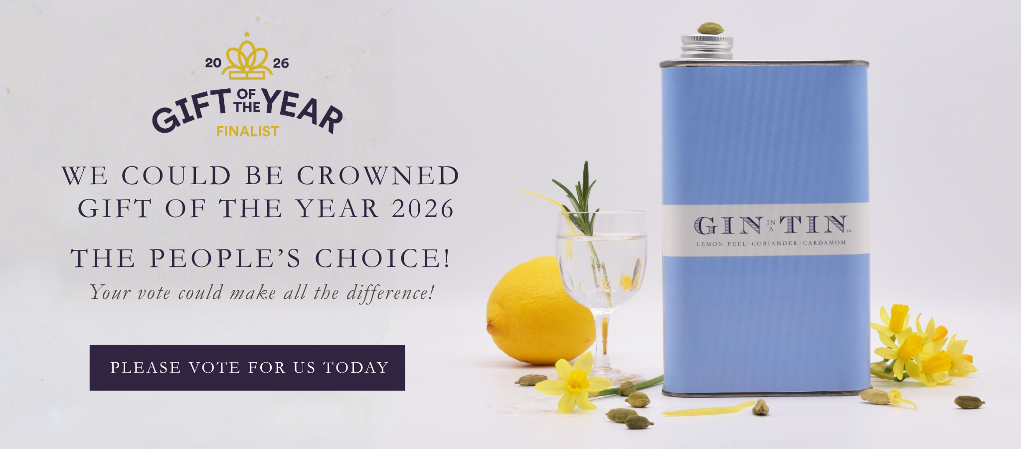 Blue gin flask with lemon and flowers on a white background, promoting 'Gift of the Year' 2026 vote.